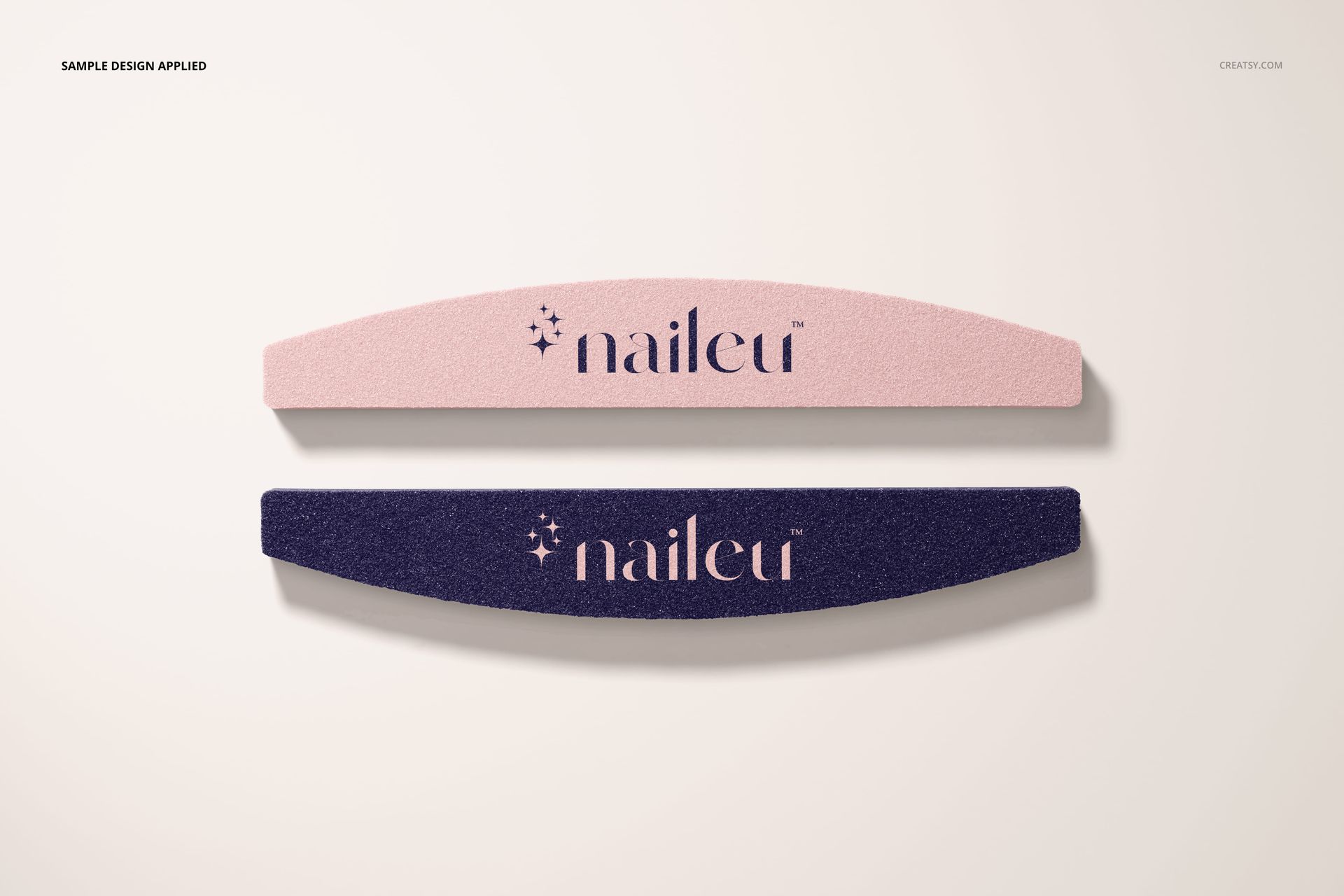 Top view of a mockup set featuring two curved nail files, one in pastel pink and one in deep purple, on a neutral background.