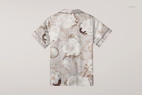 Silk short-sleeve pyjama shirt mockup with a floral pattern in soft beige and white, shown from the back.