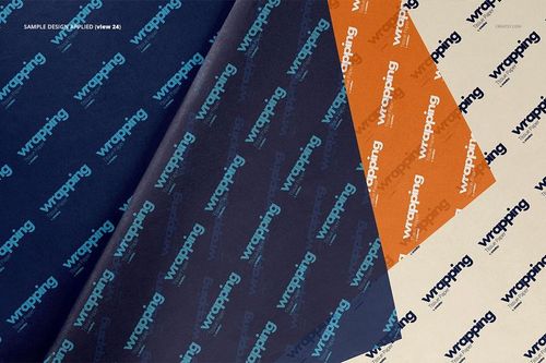 Three sheets of wrapping tissue paper mockup displayed from a top view, featuring blue, orange, and cream colors.