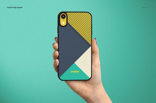 PSD mockup showing a black iPhone XR case with abstract geometric patterns, held against a solid teal backdrop.