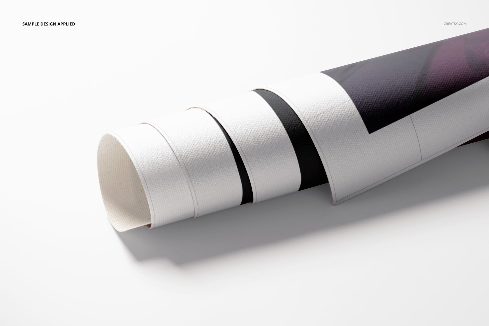 Close-up of a rolled canvas print mockup featuring a visible print area and textured material on a clean white surface.