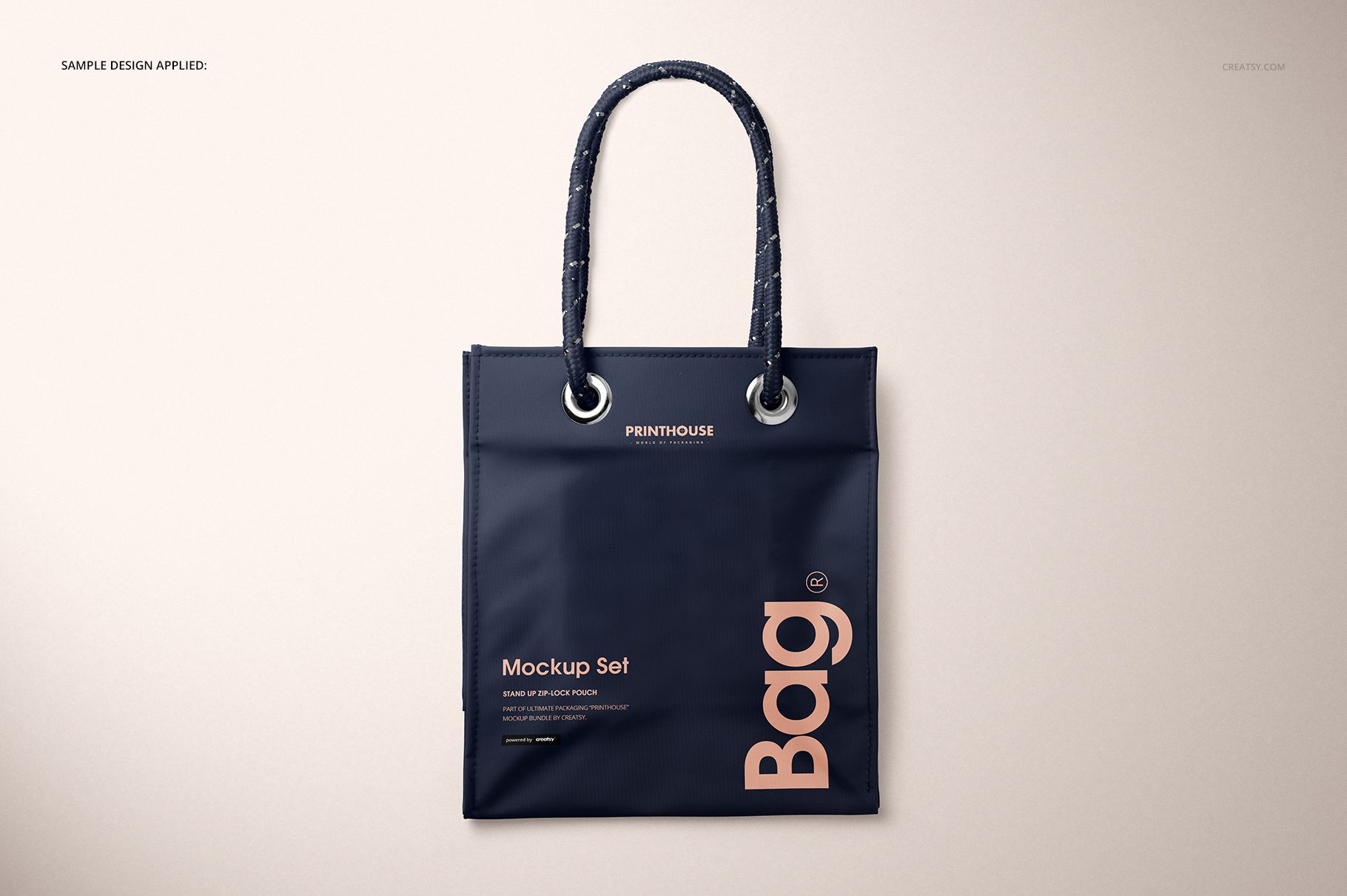 Front view of a matte PVC reusable tote bag mockup with dark navy color and rope handles on a neutral background.