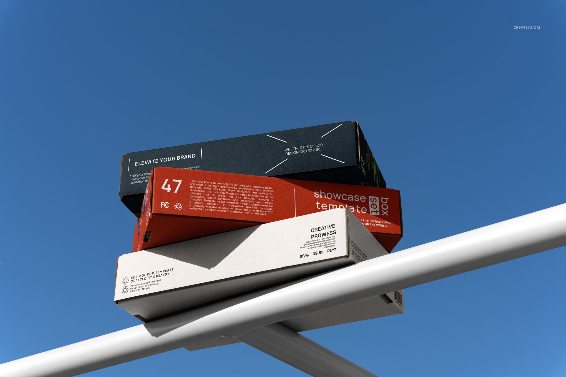 Mailing box PSD mockup set featuring stacked boxes in different colors displayed outdoors on a white railing.