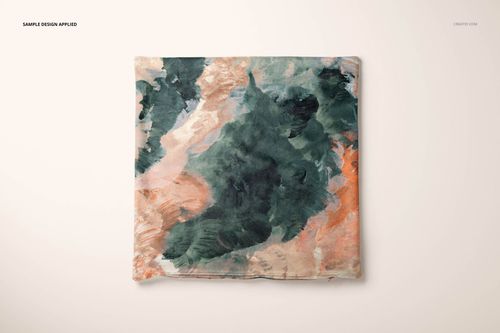Velvet cushion cover mockup featuring a square shape and artistic brushstroke design in green and peach colors.