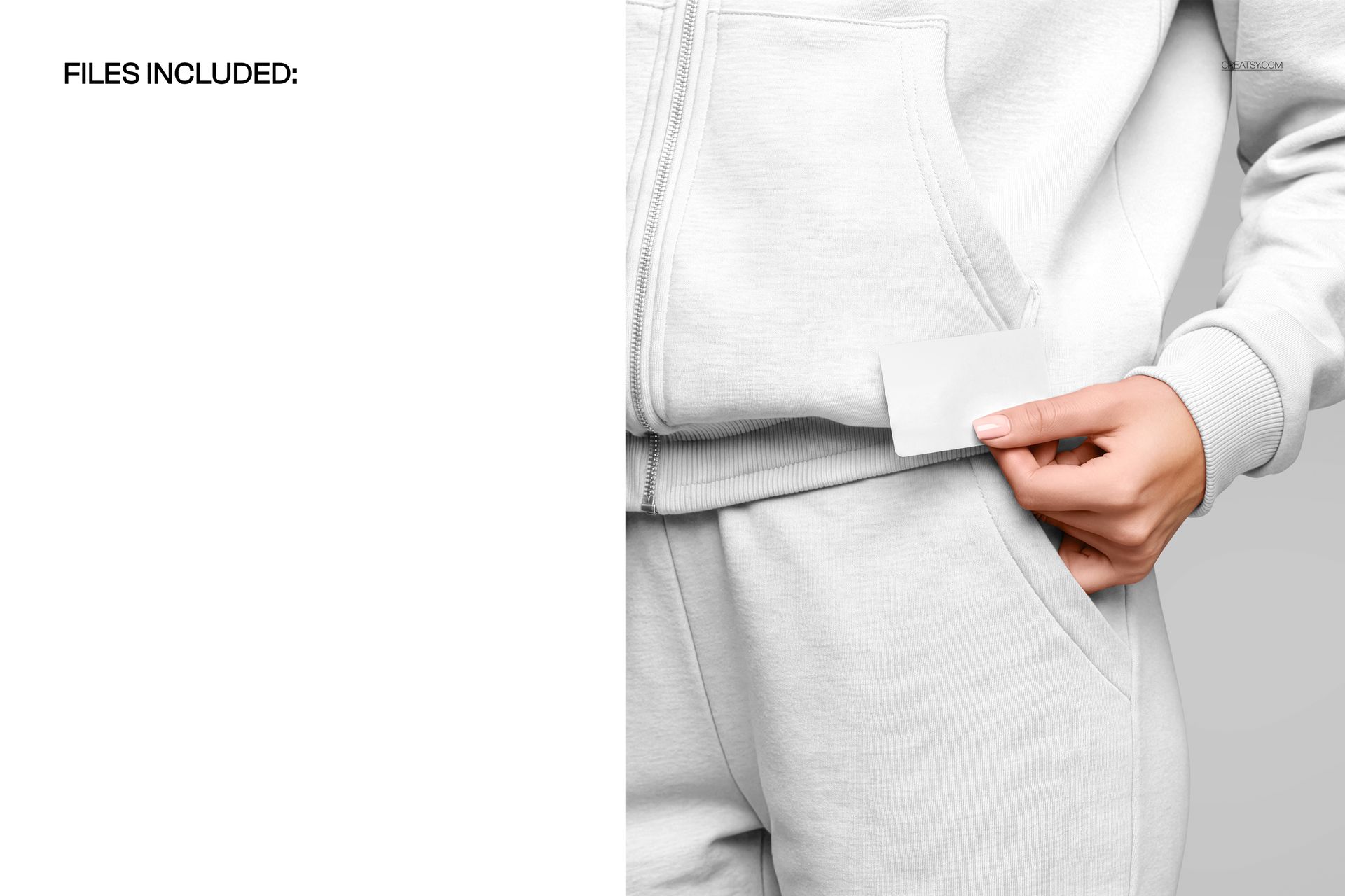 Close-up of a white tracksuit with a hand holding a blank business card near the pocket, front view mockup.