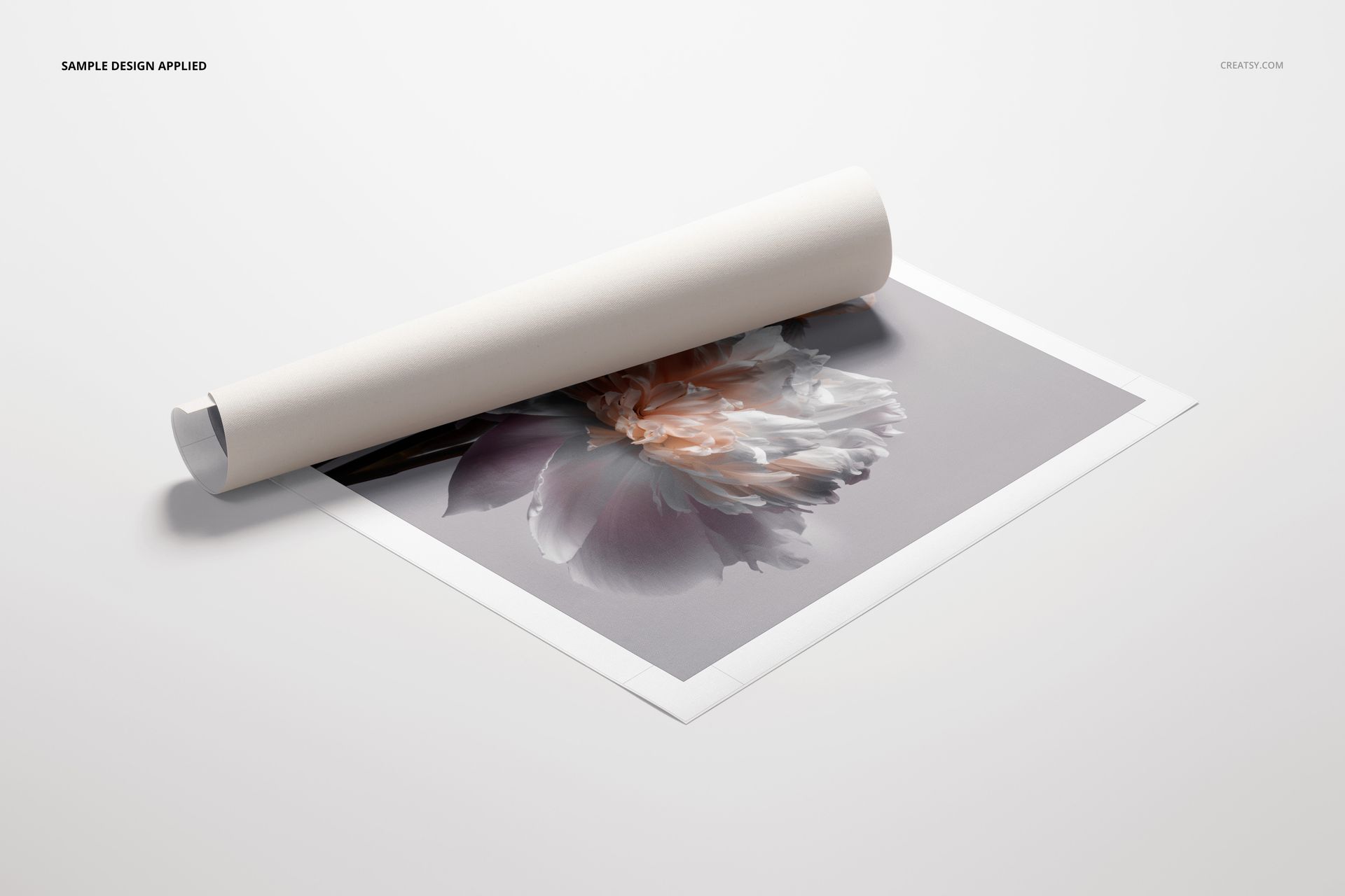 Rolled canvas print mockup with a delicate flower artwork, shown from a top angle on a plain background.