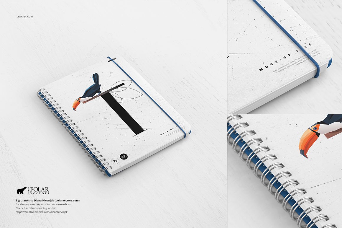 Close-up of a spiral notebook mockup with a minimalist bird design and blue elastic band, placed on a pale wood background.