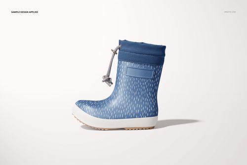 Single blue kids rain boot mockup with subtle white dash pattern, shown from the side against a plain backdrop.