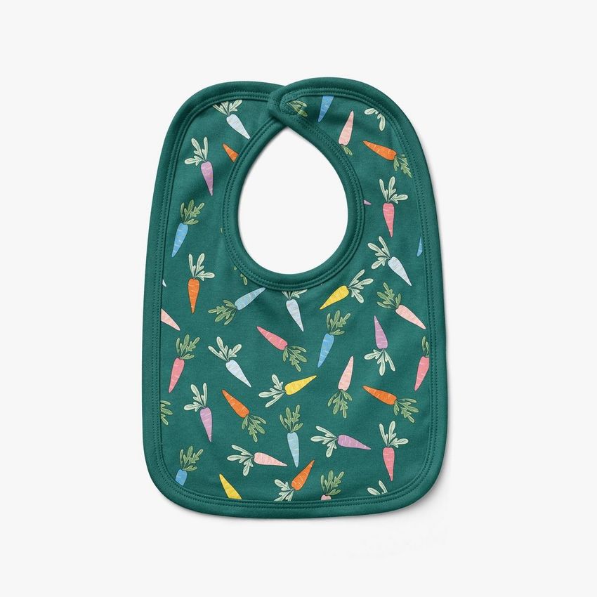 Velcro fastening bib mockup featuring a green fabric bib decorated with a colorful carrot pattern on a plain white background.