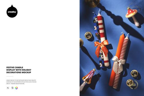 Christmas-themed PSD mockup featuring assorted patterned candles and seasonal props on a vibrant blue tabletop.