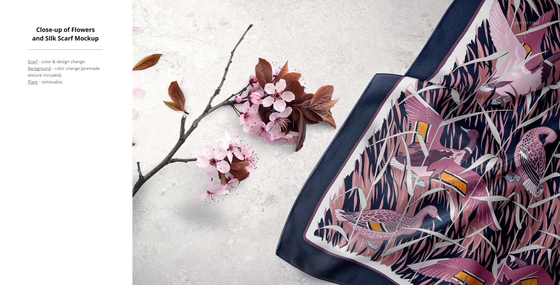 Top view of a silk fabric mockup featuring a colorful bird and floral pattern, next to pink blossoms on a branch.