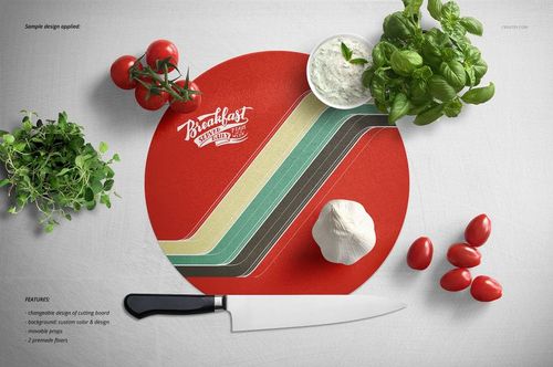 Circular cutting board mockup with retro stripe pattern, placed on white surface with fresh vegetables and herbs.