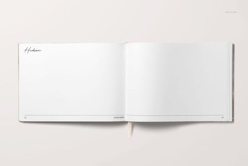 Top view of a landscape wedding guest book mockup showing clean white pages, simple lines, and a subtle ribbon.