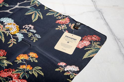 Floral silk scarf mockup displayed flat on a light marble background, featuring vibrant botanical designs.