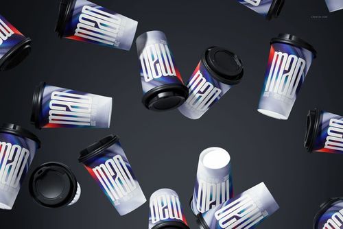 Multiple paper cups with colorful gradient designs and black lids floating against a dark background, front view.