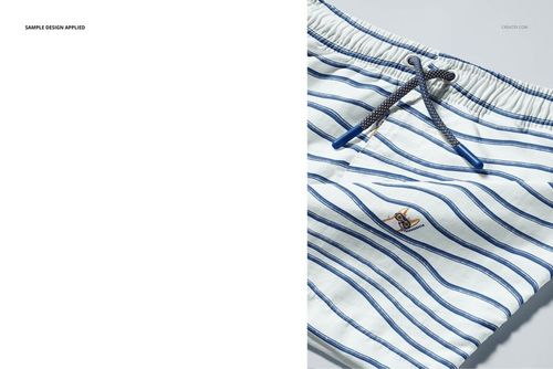 Close-up of kids swim shorts mockup showing blue striped pattern, elastic waistband, and drawstring cords on white background.
