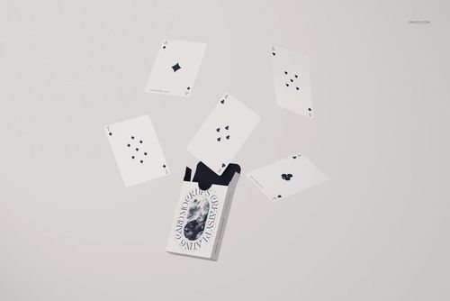 PSD mockup featuring five scattered playing cards and a partially open box, all displayed on a plain light background.