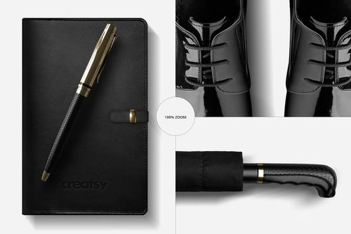 Men's fashion mockup featuring a black notepad with gold pen, glossy black shoes, and umbrella handle on white background.