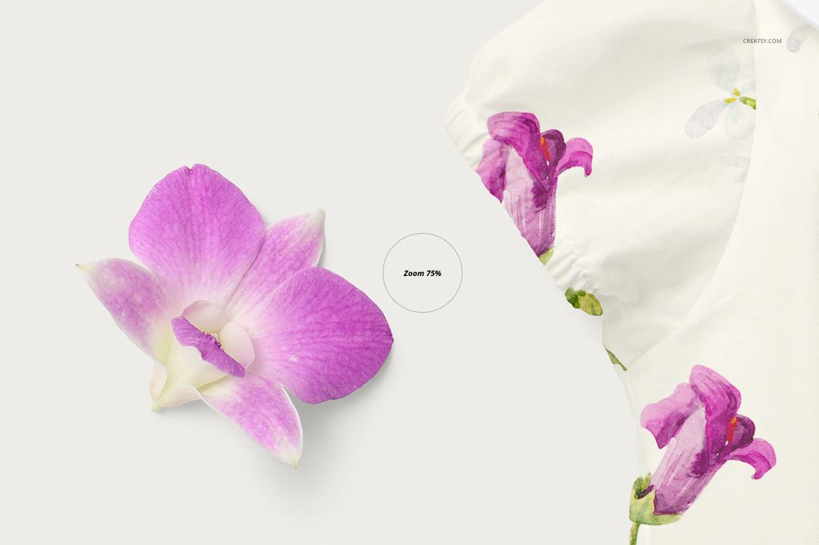 Front view of a baby romper mockup with a white fabric featuring purple orchid flower prints, next to a real orchid blossom.