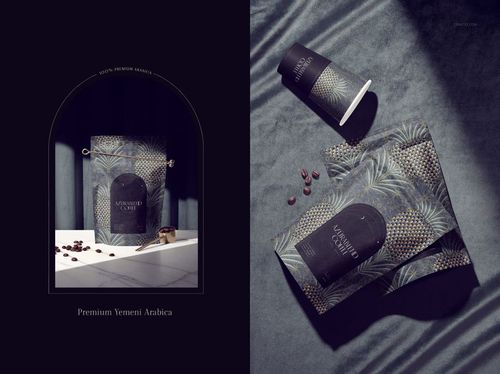 Coffee packaging mockup set featuring a pouch and cup with dark patterned labels, shown on a textured surface.