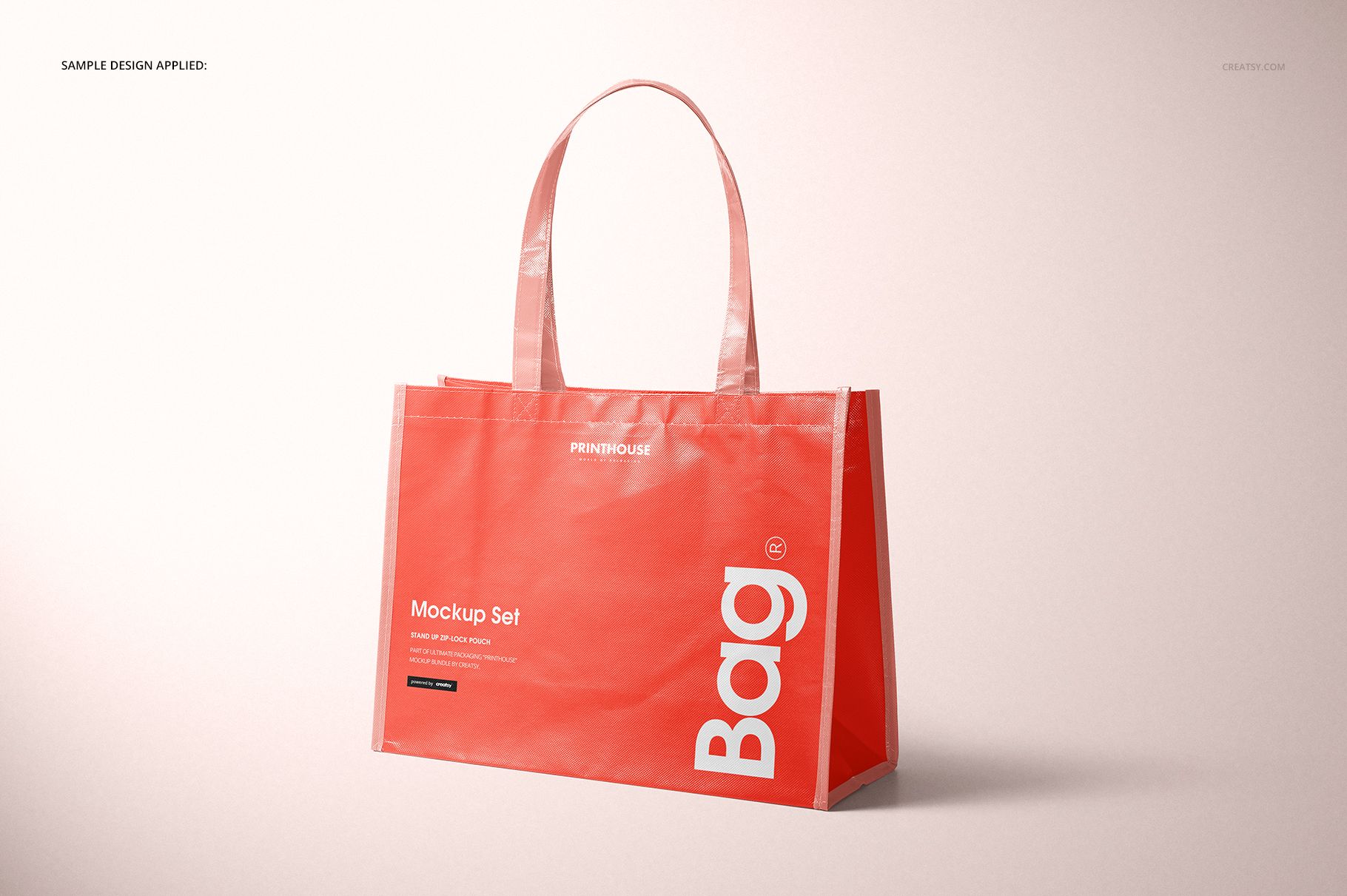 Front angled view of a laminated non-woven tote bag mockup in red with white text, set against a light background.