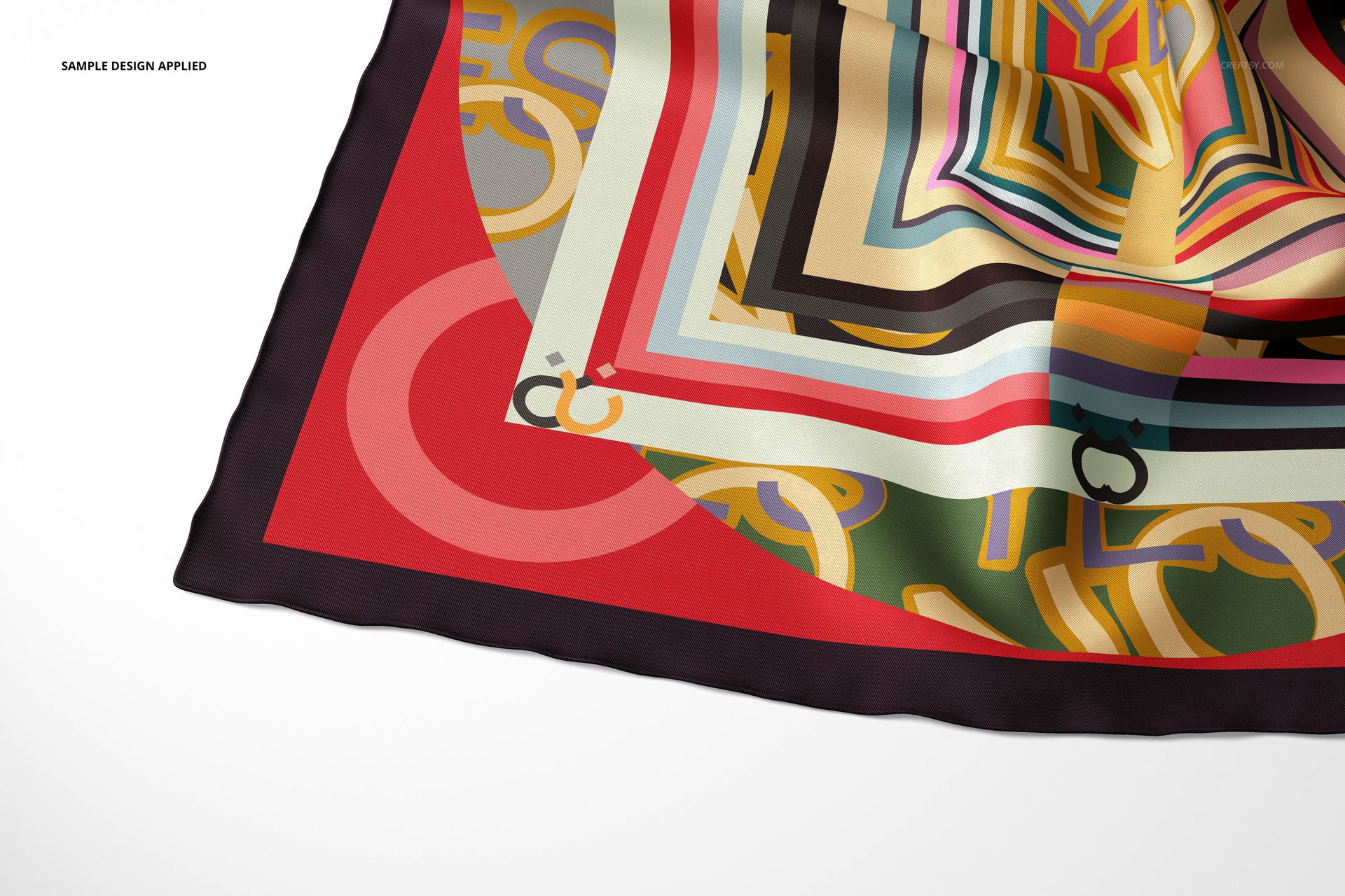 Close-up of a twill silk scarf mockup featuring bold geometric shapes and colorful lines on a white background.