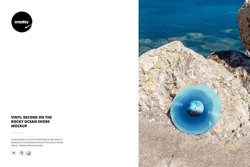 Blue vinyl record placed on rocky ocean shore with clear blue water in background, top view mockup scene.