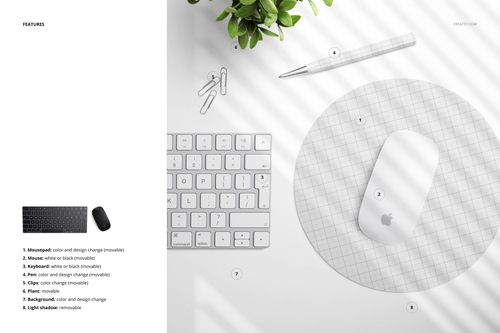 Top view of a round mouse pad mockup with a grid pattern, placed on a white desk with keyboard, mouse, and green plant.
