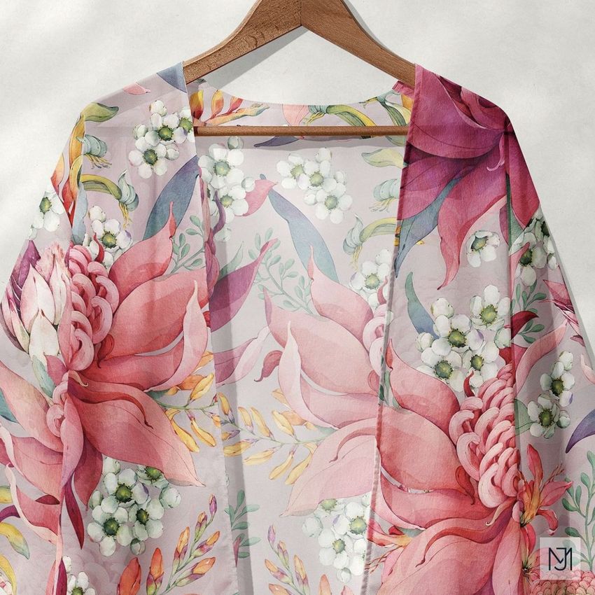 Chiffon kimono mockup featuring a floral pattern with large pink and white flowers on a light background, displayed on a wooden hanger.
