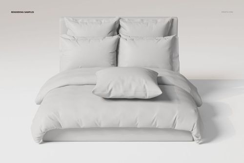 Front view of a bedding set with ruffled pillows and a duvet in solid white, arranged on a modern bed frame.