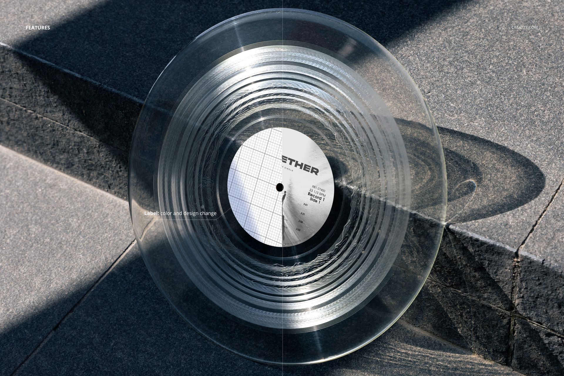 Transparent vinyl record mockup displayed on outdoor stone steps, showing circular grooves and shadow details.