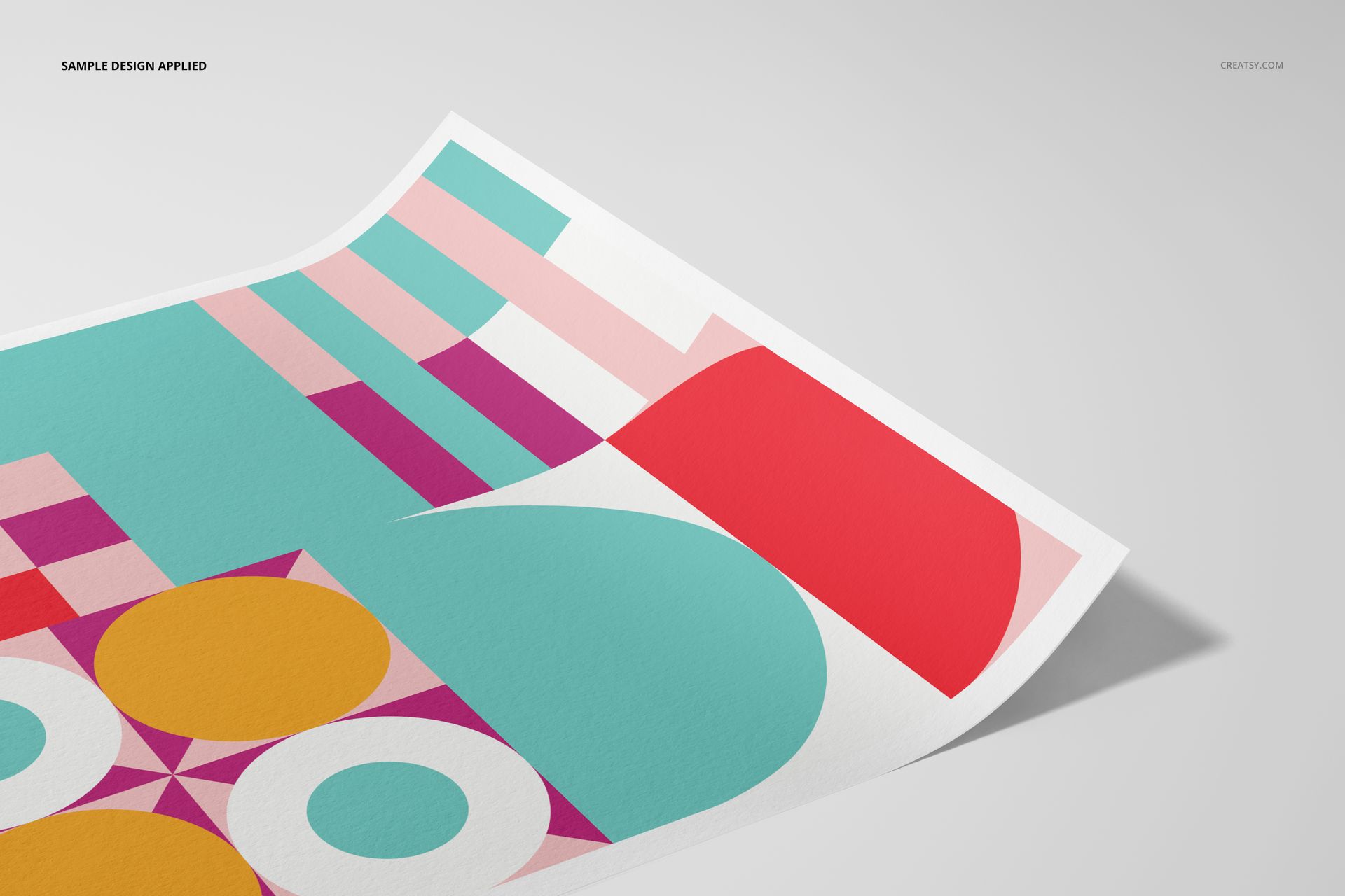 A3 fine art print mockup with colorful geometric shapes in turquoise, red, pink, and yellow on a white paper sheet.