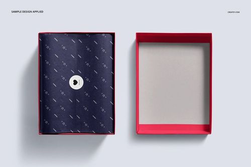 Top view of an open shoe box mockup set with a red box, patterned navy tissue paper, and removable sticker.