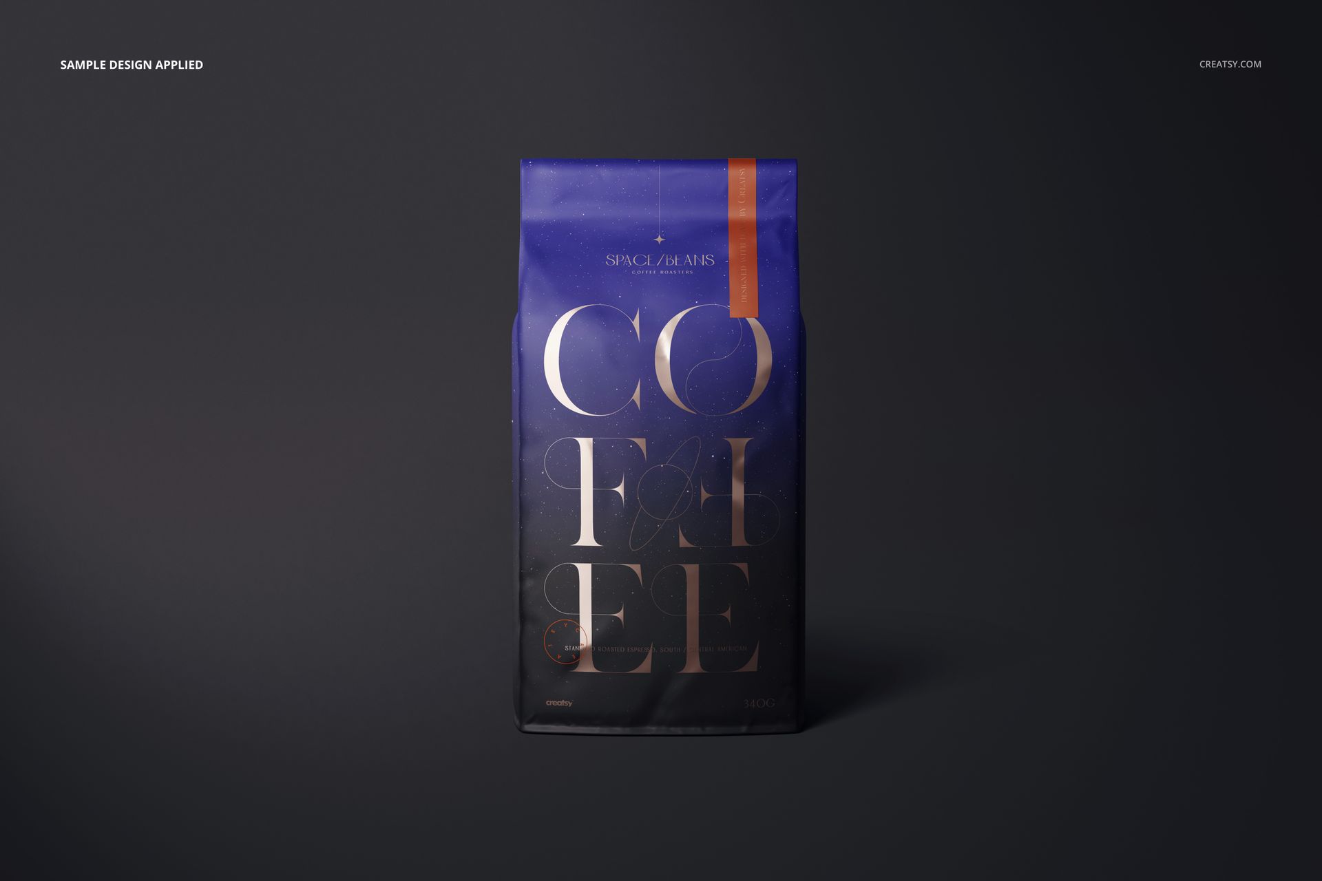 Front view of a matte coffee bag mockup with geometric blue and orange accents, displayed against a dark background.