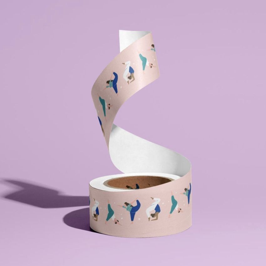 Packing tape mockup featuring a roll of tape with illustrated yoga poses on a pastel pink background and a purple surface.