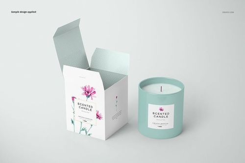 Front view of a classic candle and open box mockup, featuring a light blue candle jar and floral label design on a white background.