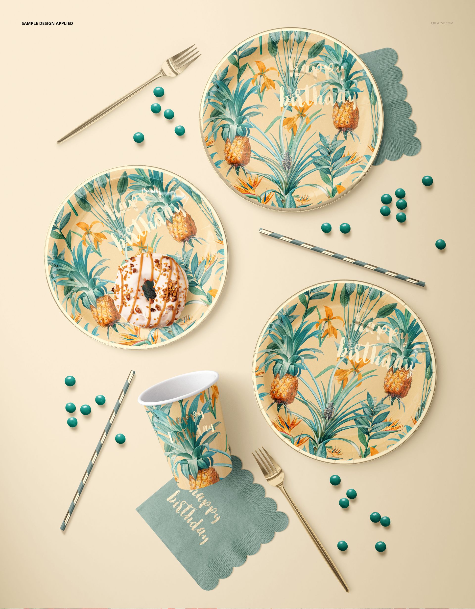 Disposable paper plates, cup, and napkin mockup with pineapple and leaf pattern, top view on a beige surface.