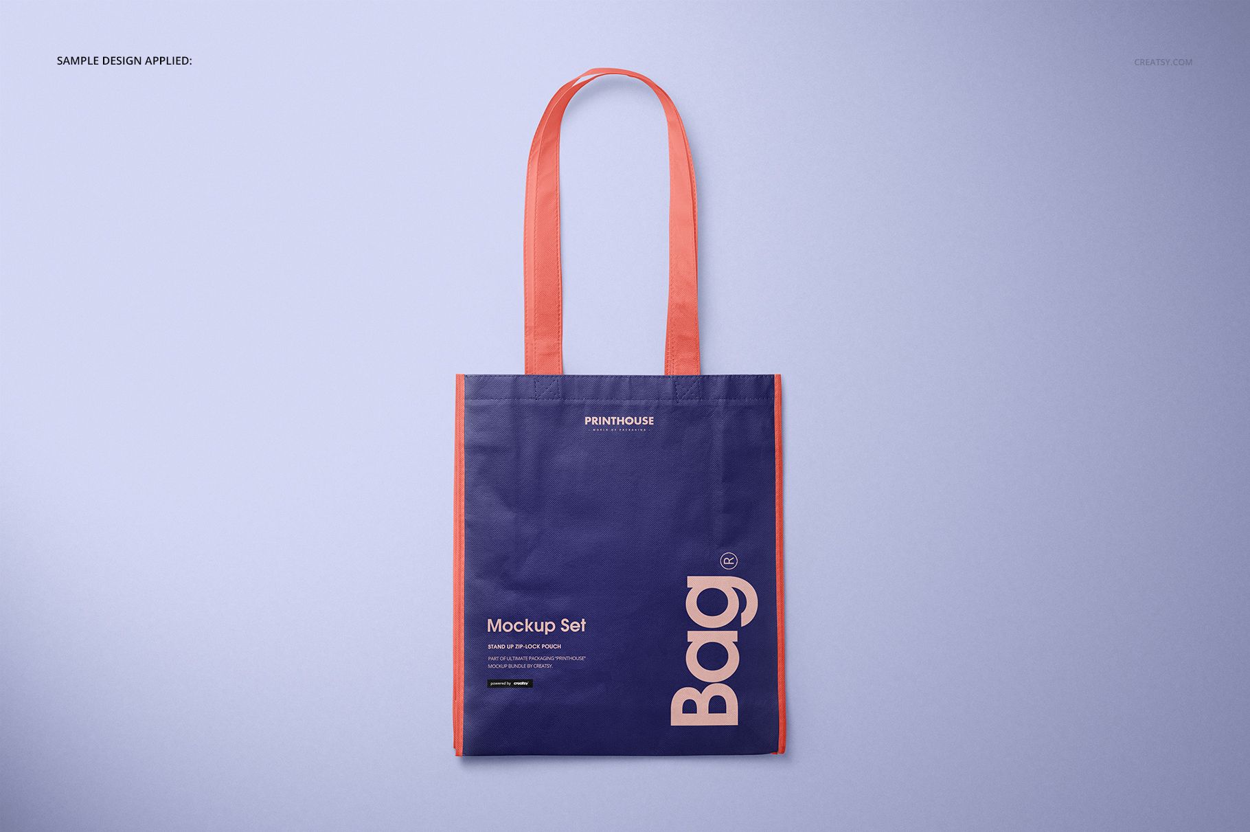 Front view of a laminated non-woven tote bag mockup with purple body, pink handles and trim, on a light background.