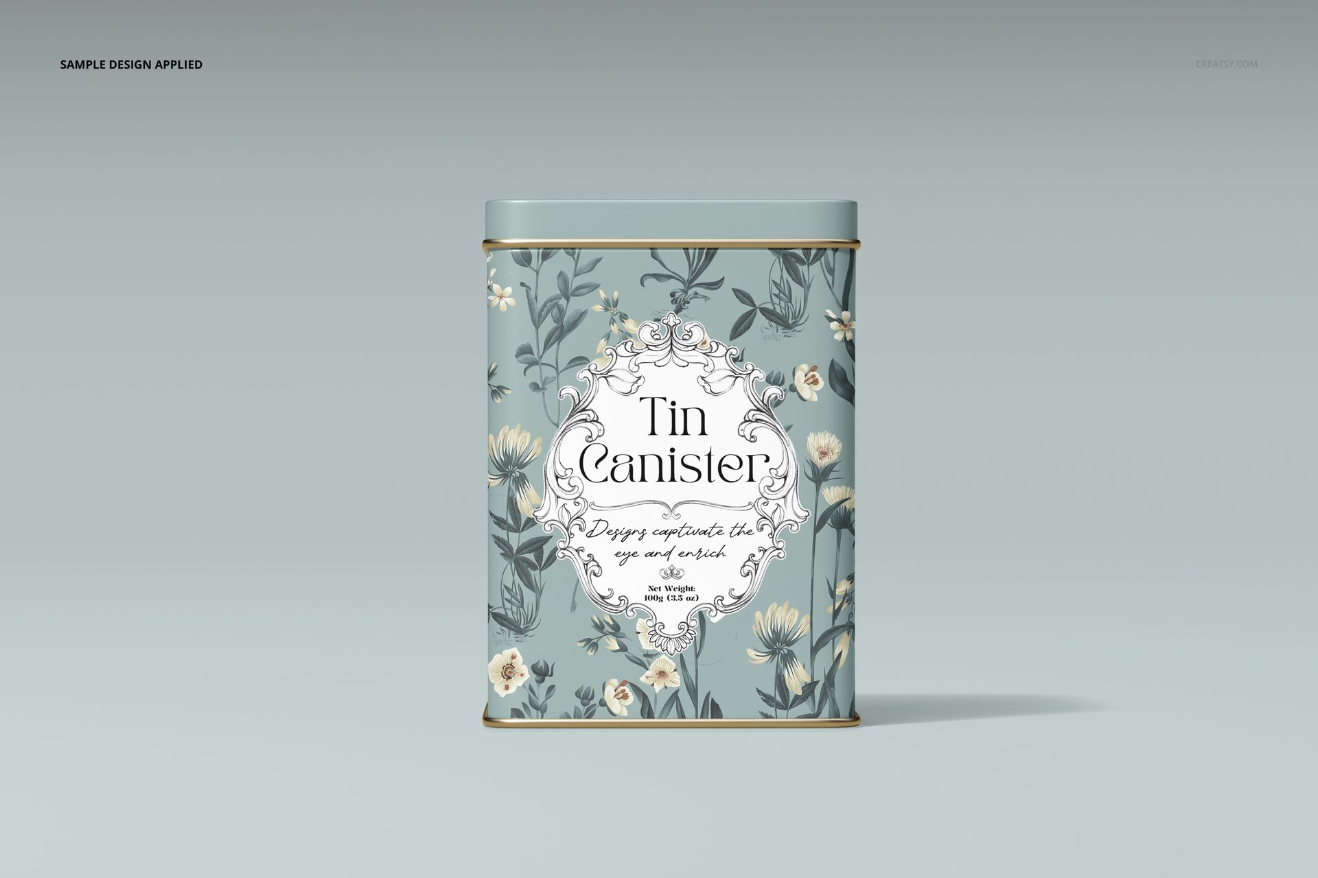 Rectangular tin canister mockup featuring soft green tones, white flowers, and ornate label, displayed on a plain surface.