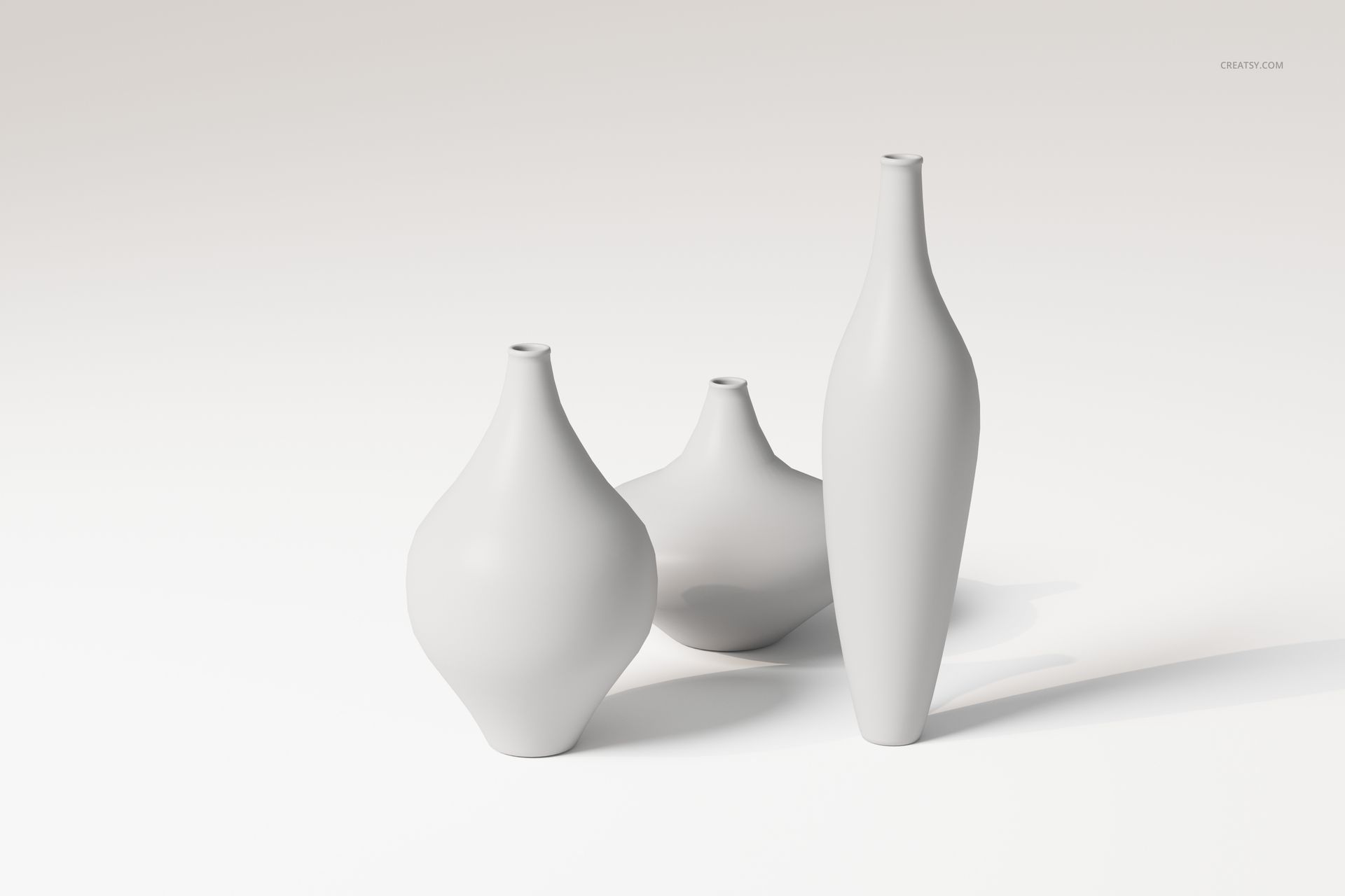 Three decorative vases in different sizes and shapes, displayed on a light surface with a soft shadow effect.