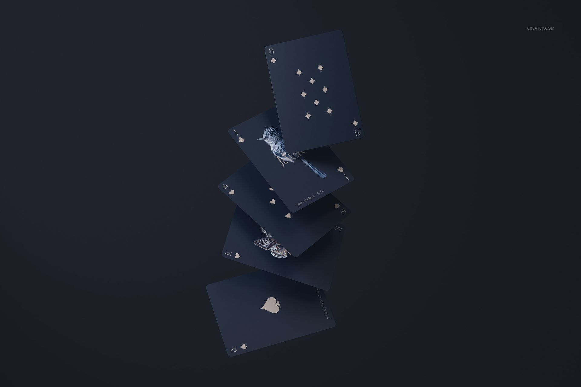 PSD mockup showing several blue playing cards with minimalistic white patterns, appearing to hover in space.
