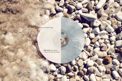 Aerial view of a vinyl record mockup placed on a rocky Adriatic coast with foamy water on the left side.