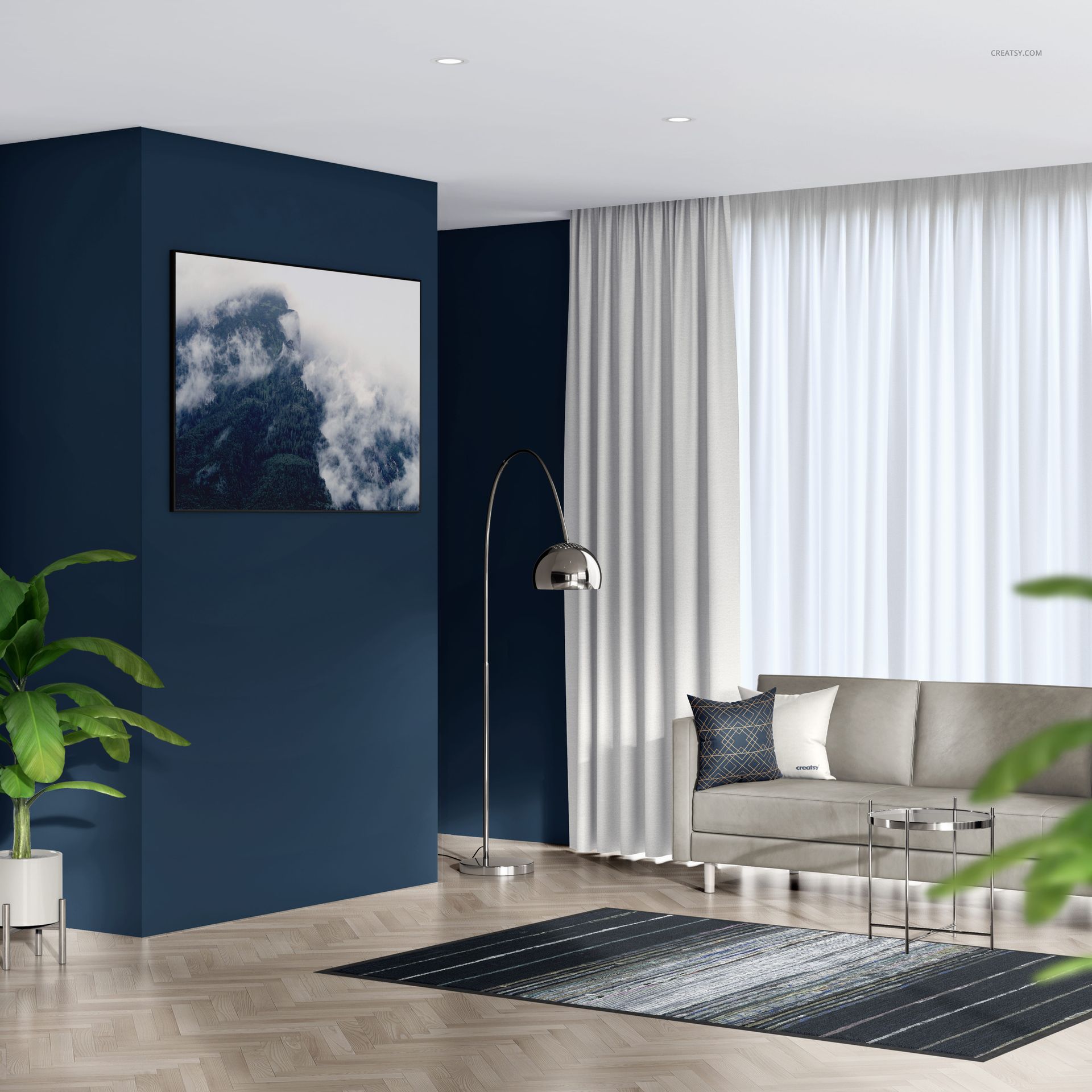 Modern living room with textile frame mockup, featuring a blue accent wall, gray sofa, and large window with sheer curtains.