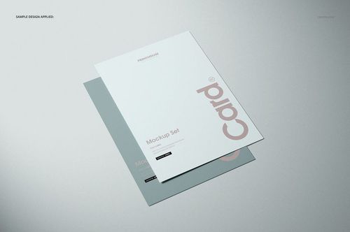 Flat cards mockup set featuring two paper cards with simple text and muted colors, arranged on a gray surface.