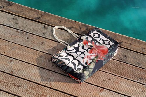 Spun polyester weekender bag mockup displayed on a sunlit wooden dock, showing vivid patterns and summer colors.