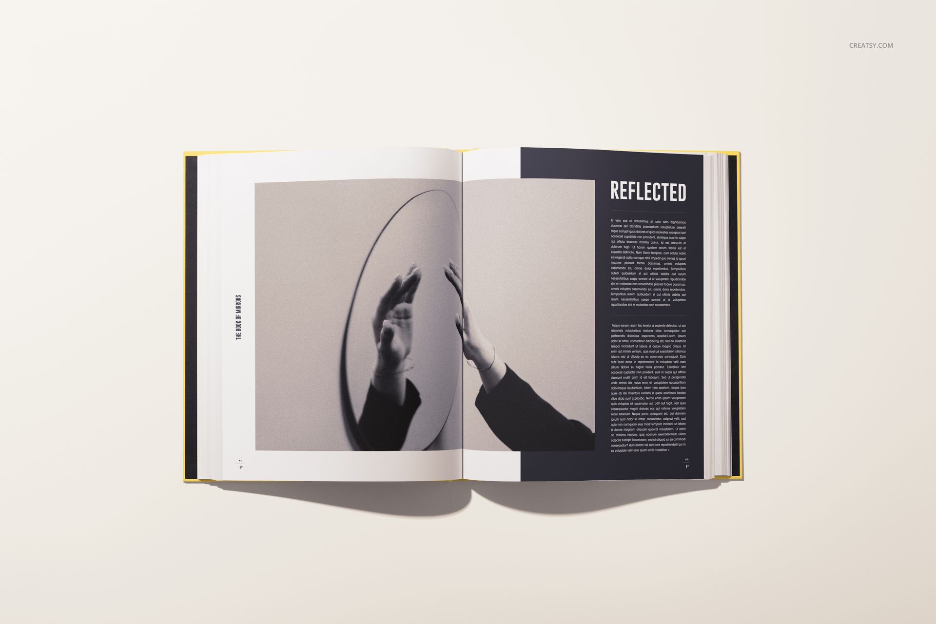 Hardcover book mockup featuring an open spread with a monochrome image of a hand and bold text on both pages.