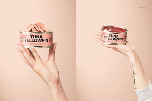 Short flat tin can mockup set shown in two hands, featuring an open can with tuna and a closed can, peach backdrop.