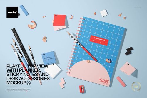 Playful top-down scene featuring a planner, sticky notes, patterned pencils, and small desk props on a blue background, shown as a PSD mockup.