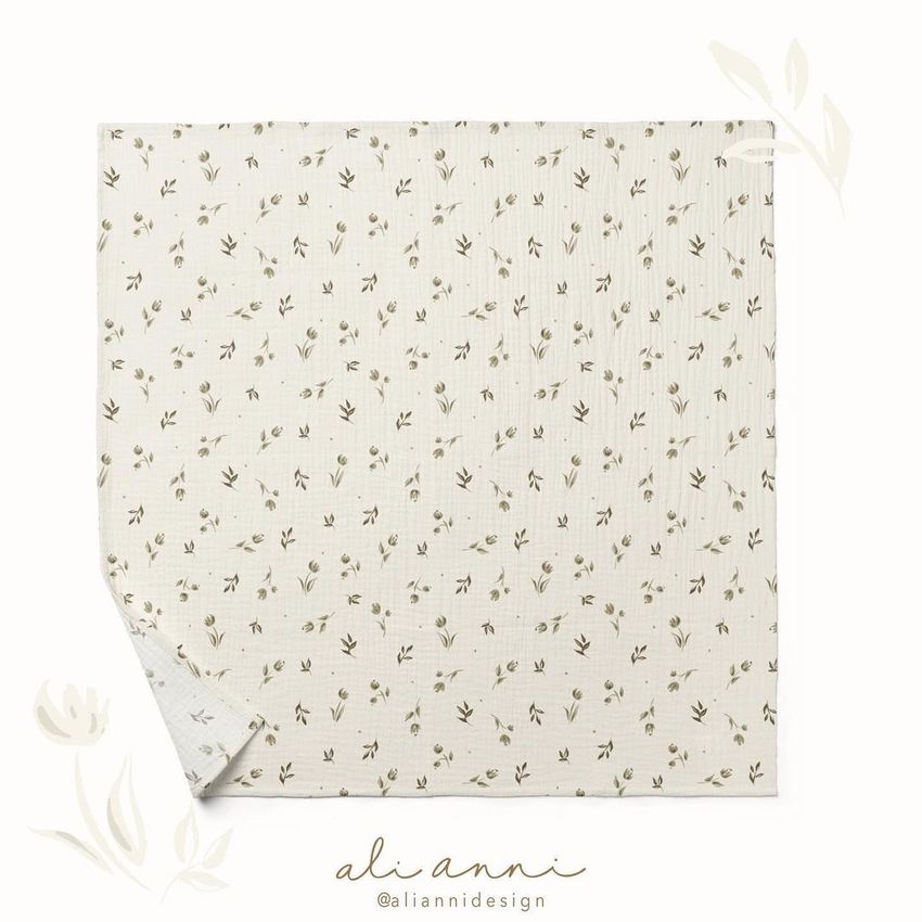 Crinkle muslin swaddle blanket mockup featuring a square cream fabric with a subtle green leaf pattern on a white background.