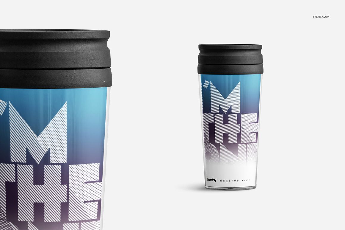 PSD mockup of a travel mug with a black lid, displaying a graphic blue and white pattern and prominent lettering.